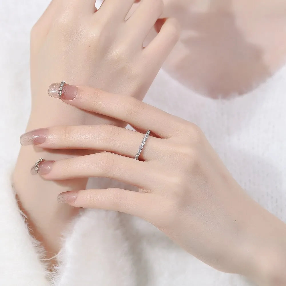 Geometric open-mouth women's ring with diamond tail detail in white gold or yellow gold colour finish.