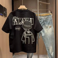 Men's black and white cotton short sleeve t-shirt with cartoon print, showing crew neck and straight cut.