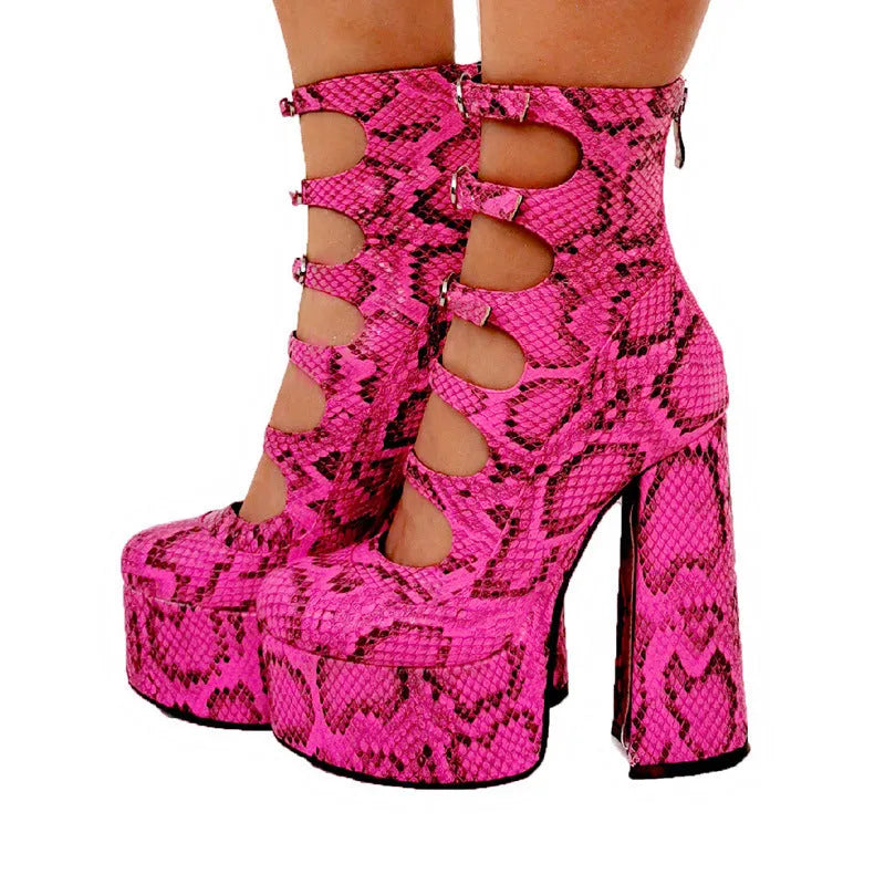 Women's black waterproof platform high-heel boots with a serpentine belt buckle fastening.