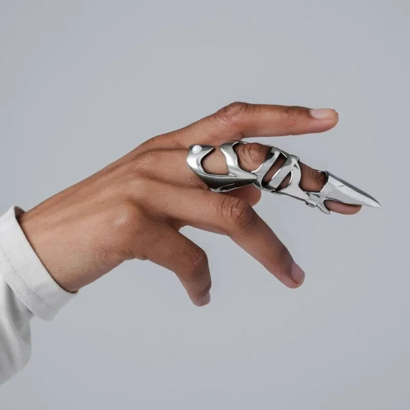 Silver-coloured punk armour finger stall ring made of alloy.