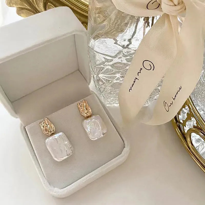 Square freshwater pearl stud earrings with geometric quadrilateral faces in purple, white or pink colours