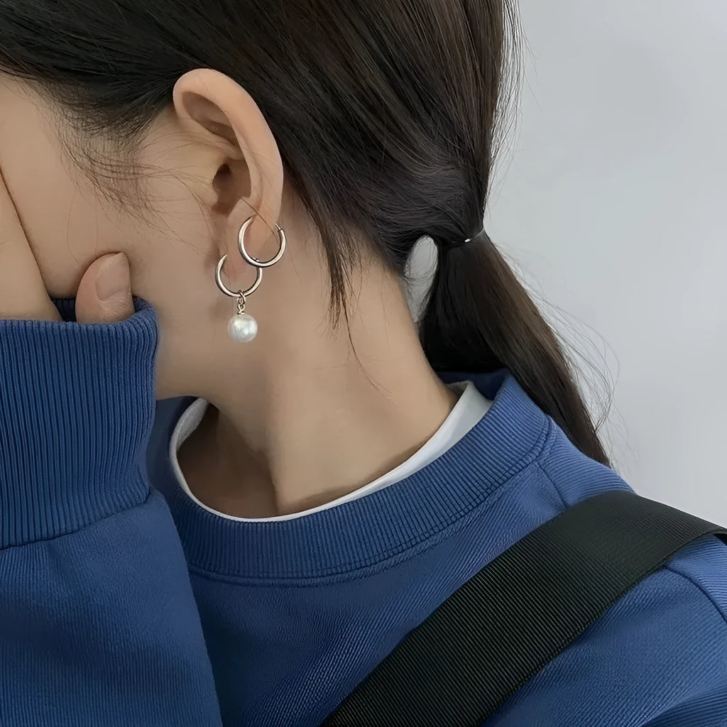Geometric pearl hoop earrings with circular design and titanium steel alloy construction
