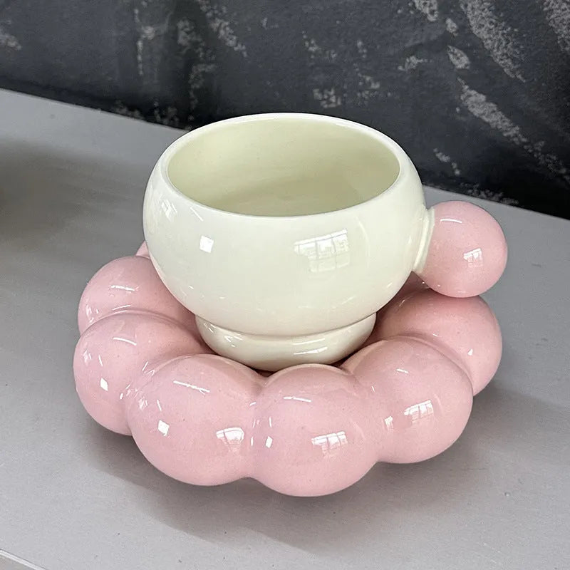 Ceramic coffee cup and saucer set in a simple Nordic design, shown in a choice of colours.