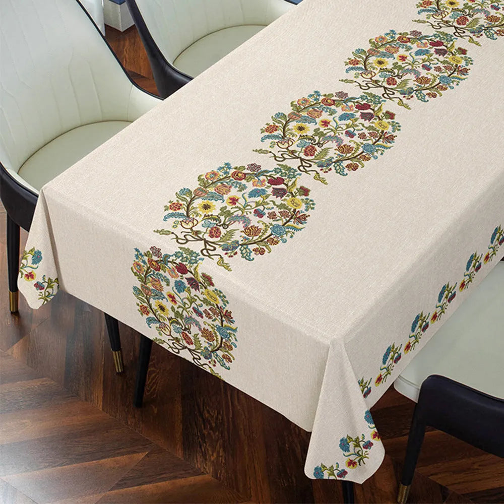 Rectangular PVC tablecloth on a coffee table, showing a geometric pattern and non-slip backing.