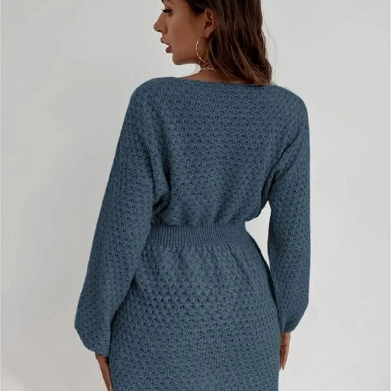 Blue women's knitted dress with hand-crocheted floral details and a fitted waist.
