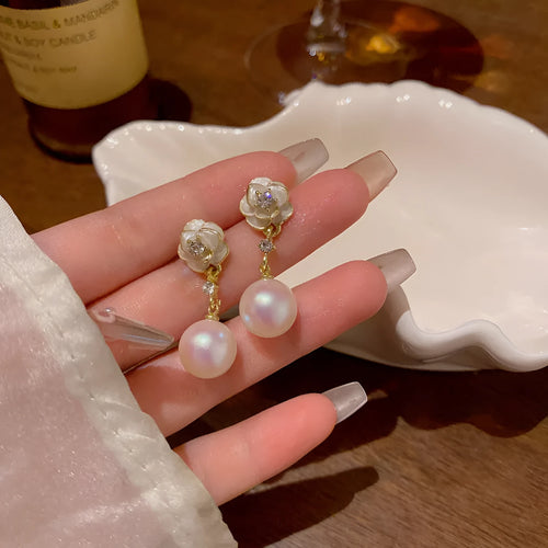 Camellia flower stud earrings with alloy construction and floral detailing