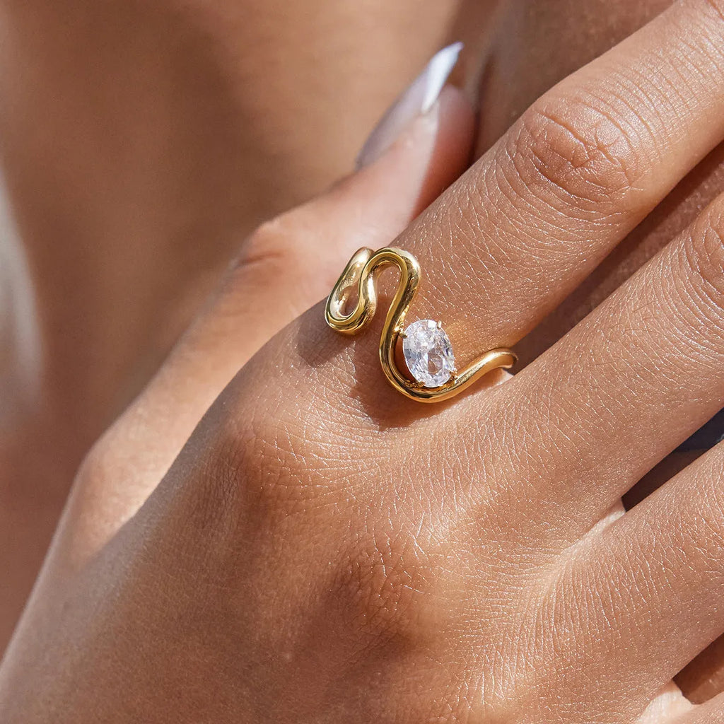 Men's geometric zircon ring in titanium steel on a grey background.