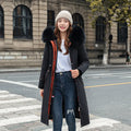 Women's long beige fleece trench coat with two-way zip, shown on a model.