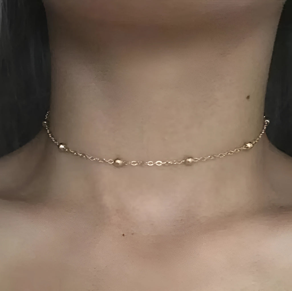 Women's metal anklet with geometric pendant on twisted chain