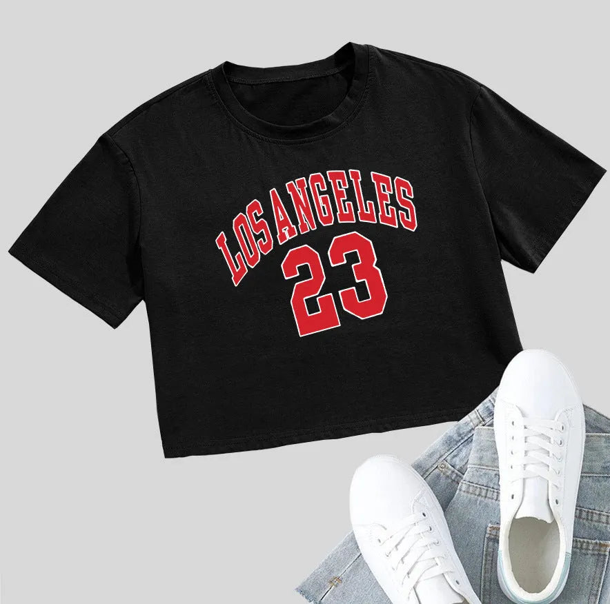 Women's black loose fit cotton T-shirt with exposed navel design and printed white English letters.