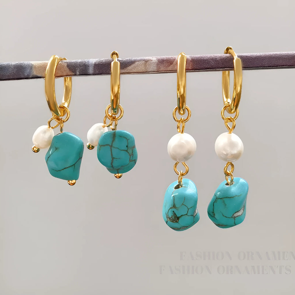 A set of two pairs of women's ear clips: one short and one dangle style, with geometric copper design, turquoise, and cultured pearls.