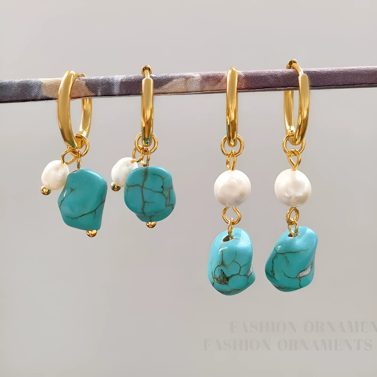 A set of two pairs of women's ear clips: one short and one dangle style, with geometric copper design, turquoise, and cultured pearls.