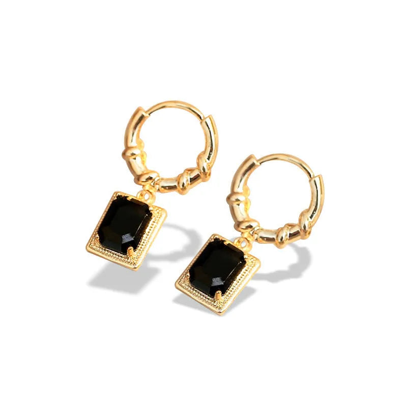 Geometric black zircon drop earrings with a copper alloy frame and quadrilateral shape.