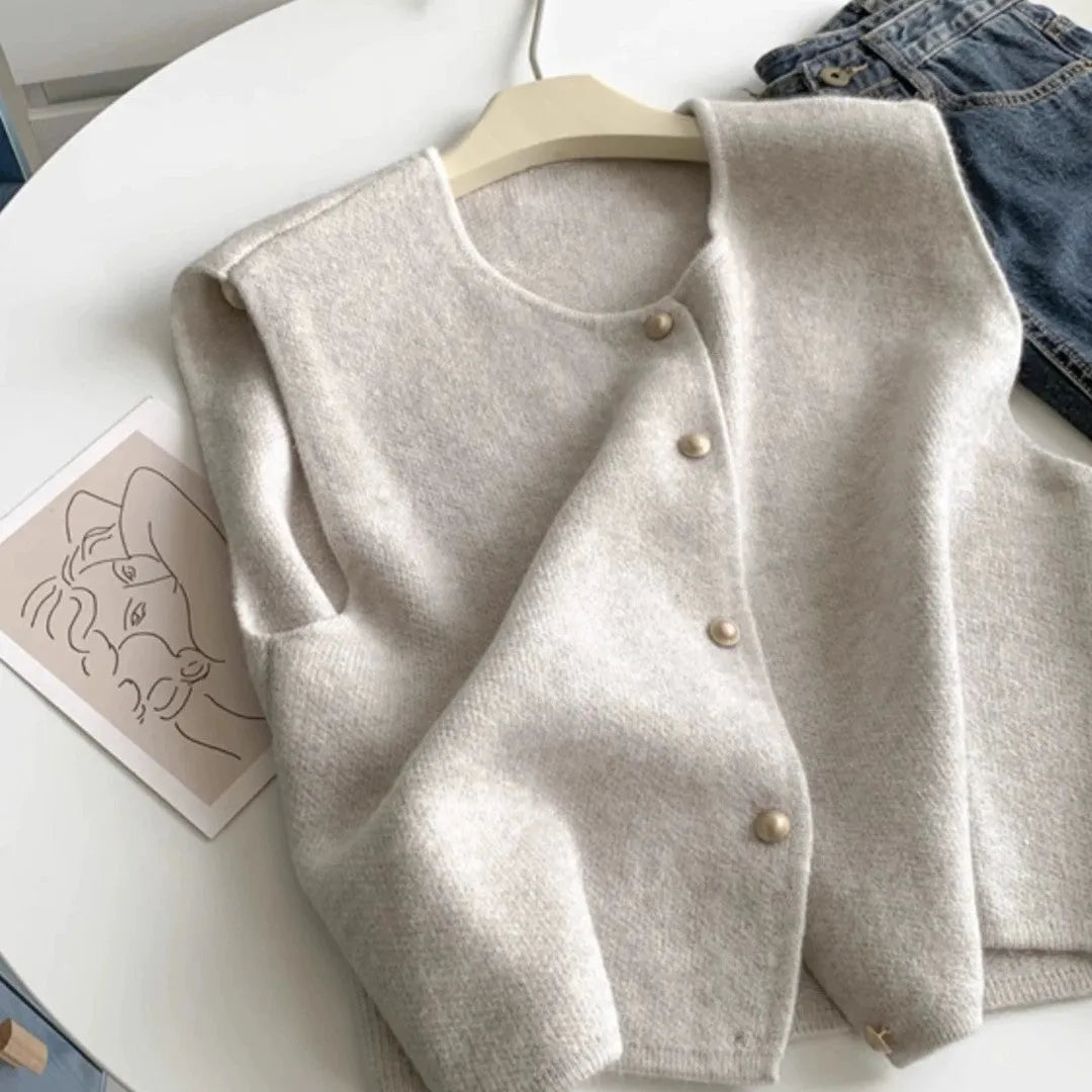A smoky grey polyester half-sleeve pullover vest laid flat, showing its regular sleeve and commuter style.