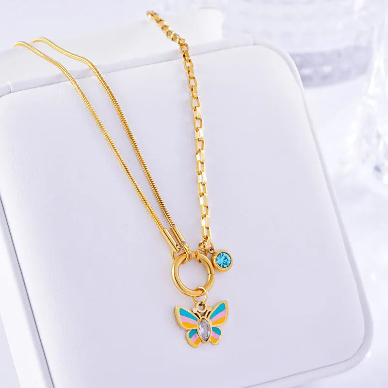 Gold titanium steel butterfly necklace and bracelet jewellery set with animal modelling details