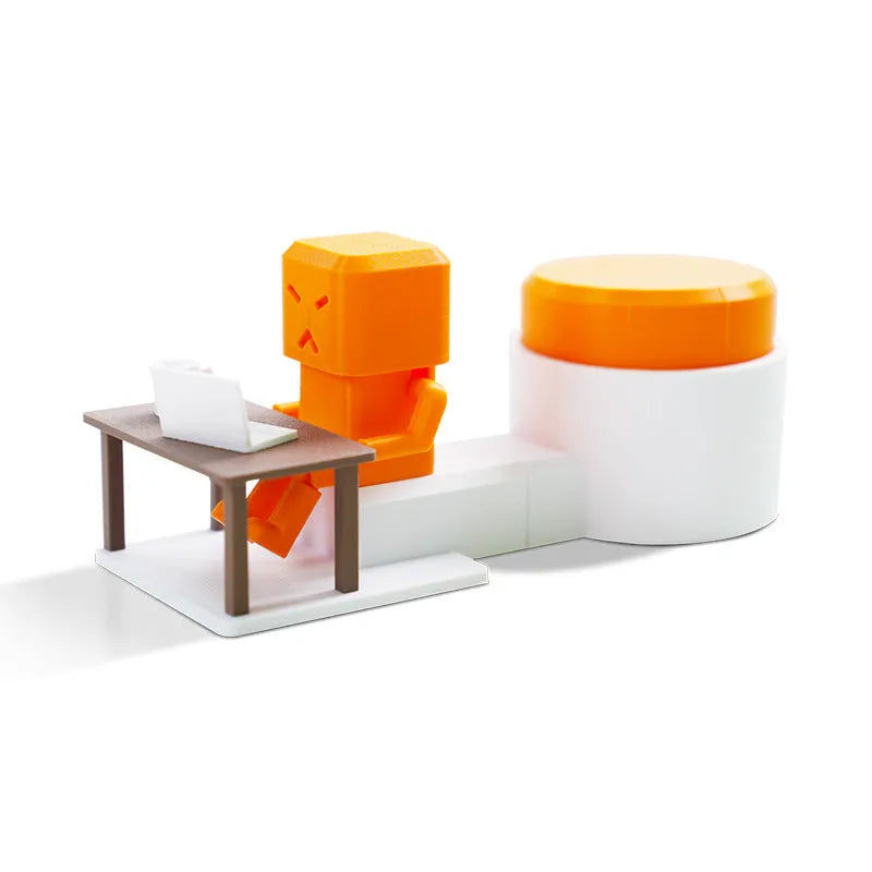 Orange plastic decompression toy with table-turning mechanism on flat surface