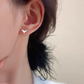 Women's fishtail design earrings in electroplated copper with gold colour finishes