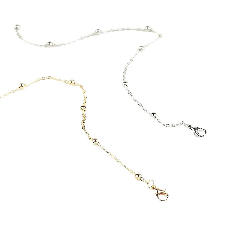Women's metal anklet with geometric pendant on twisted chain