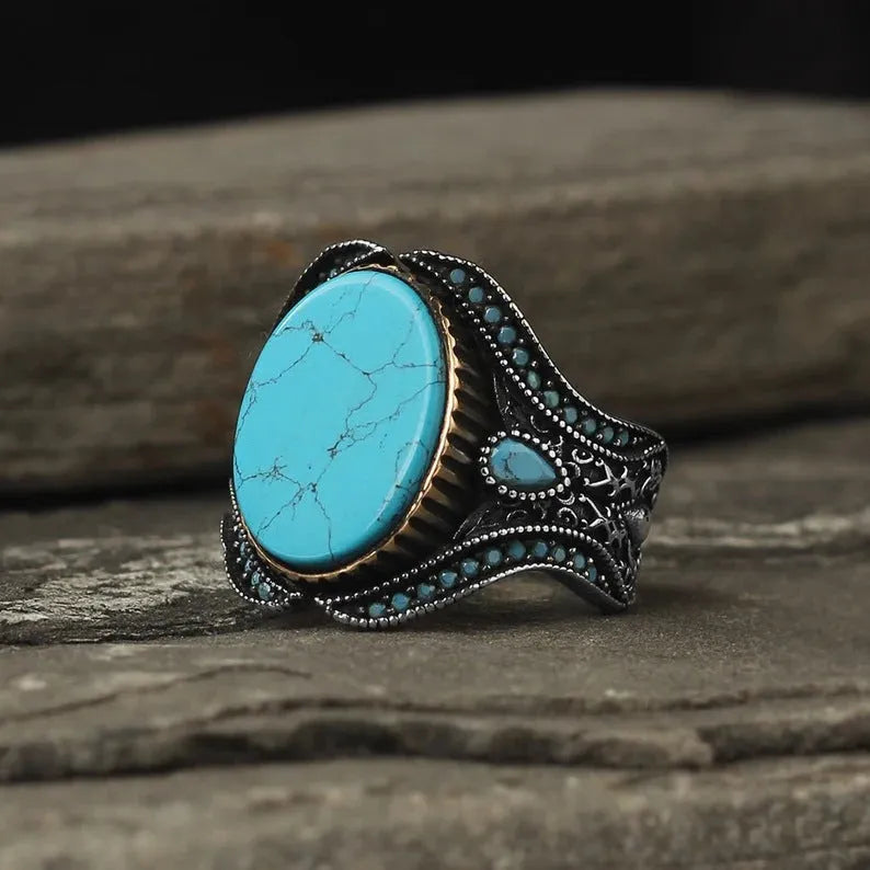 Men's antique silver turquoise alloy ring showing simple round band design on a size guide.