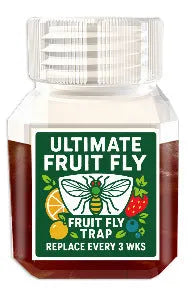 Bottle of SK003 fruit fly trapper bait liquid on a kitchen counter.