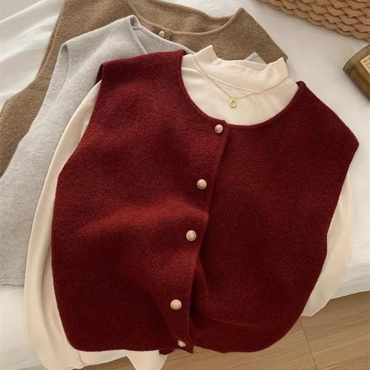 A smoky grey polyester half-sleeve pullover vest laid flat, showing its regular sleeve and commuter style.