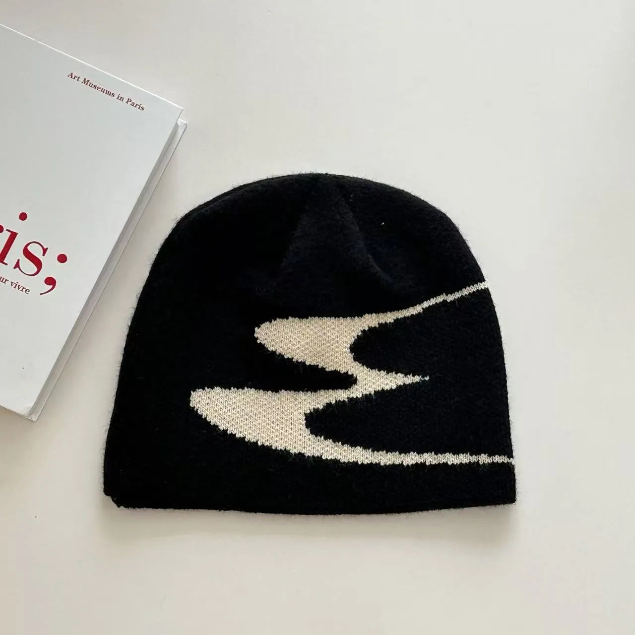 Acrylic thermal beanie hat in black colour on head model
