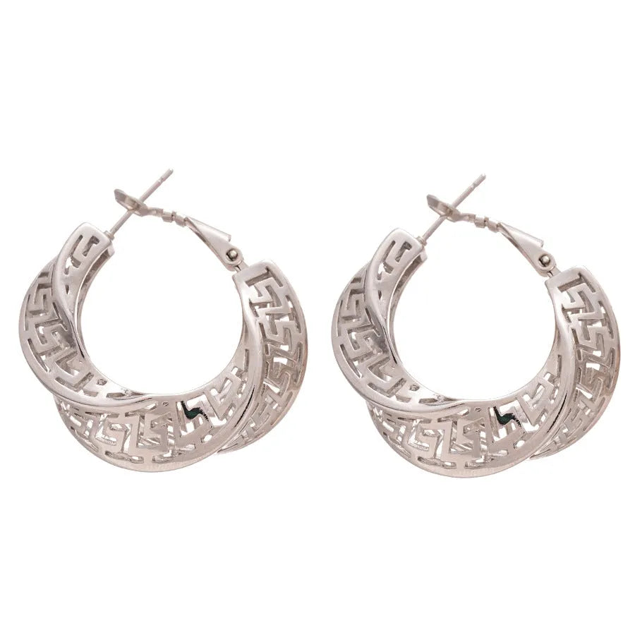 A pair of twisted round geometric hollow stud earrings for women in a gold or silver metallic finish.