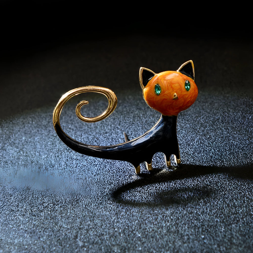 White or orange kitty cat brooch with painted upward tail design on alloy metal