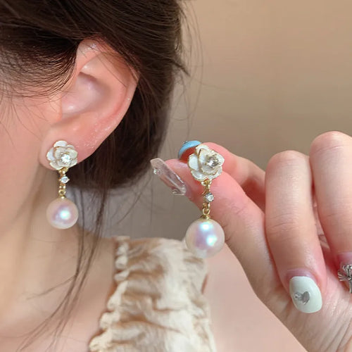 Camellia flower stud earrings with alloy construction and floral detailing