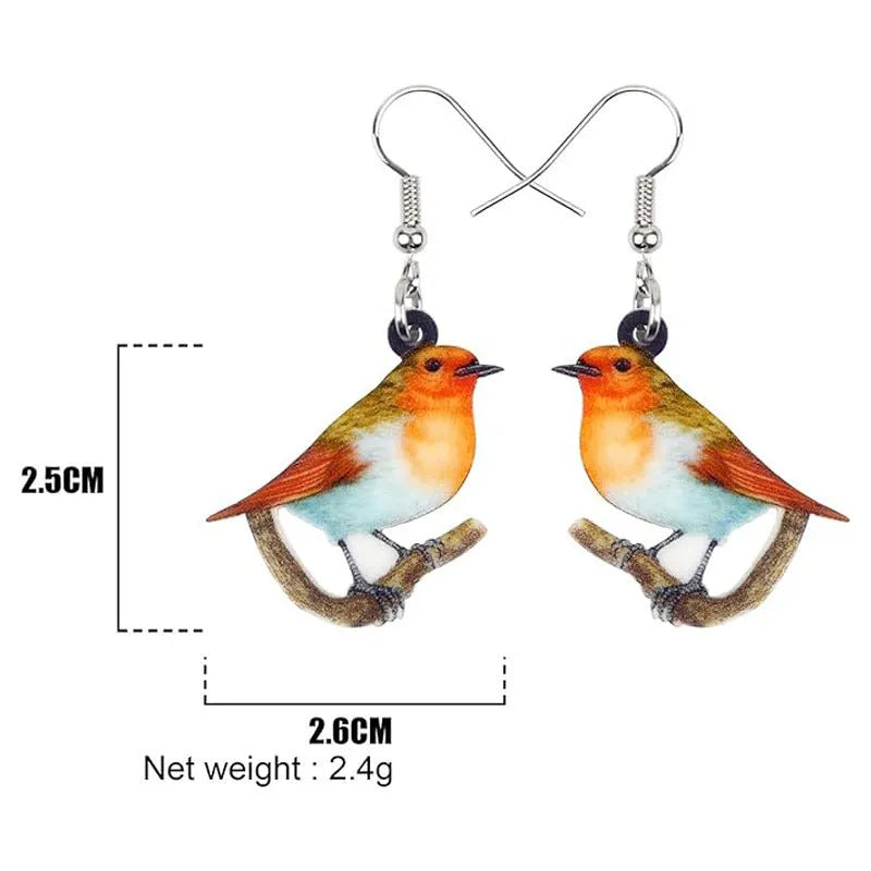 Blue Titmouse and snake motif acrylic drop earrings with geometric pendant shape on a white background.