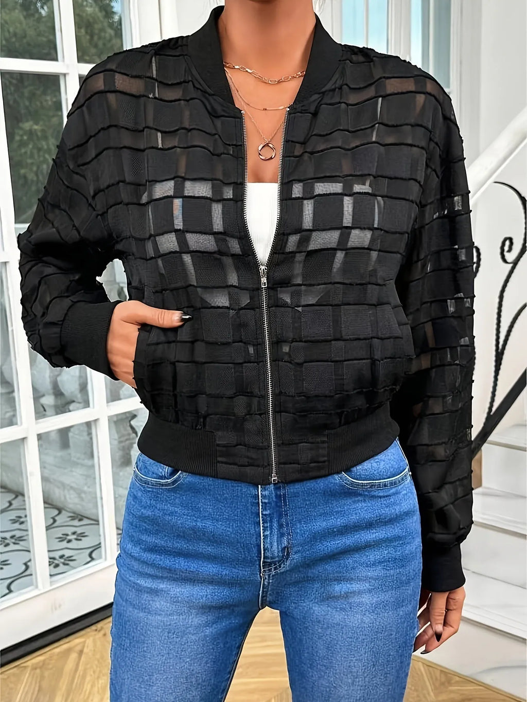 Black women's casual jacket with white geometric thread pattern and front zipper.