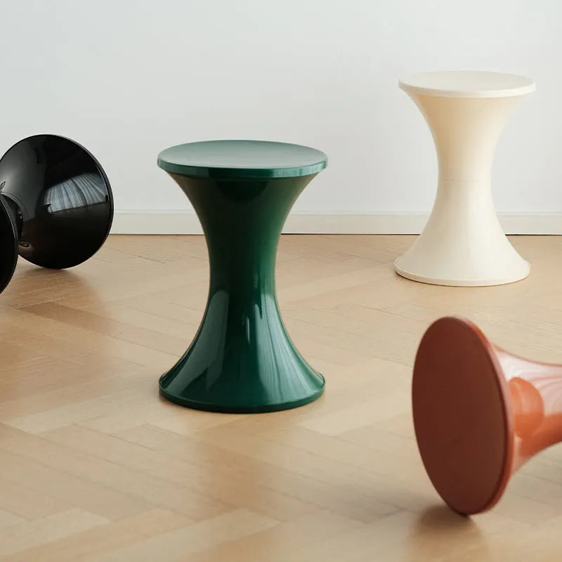 A plastic hourglass-style shoe changing stool in one of five available colours.