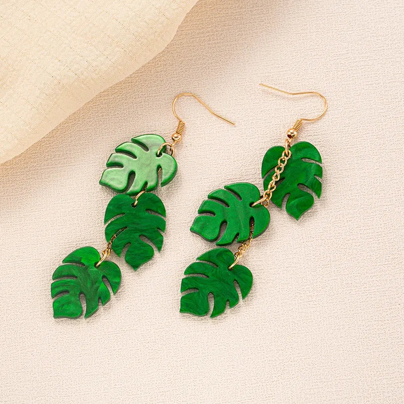 Acrylic drop earrings with coconut and jackfruit design on the ear hook in one of five styles.