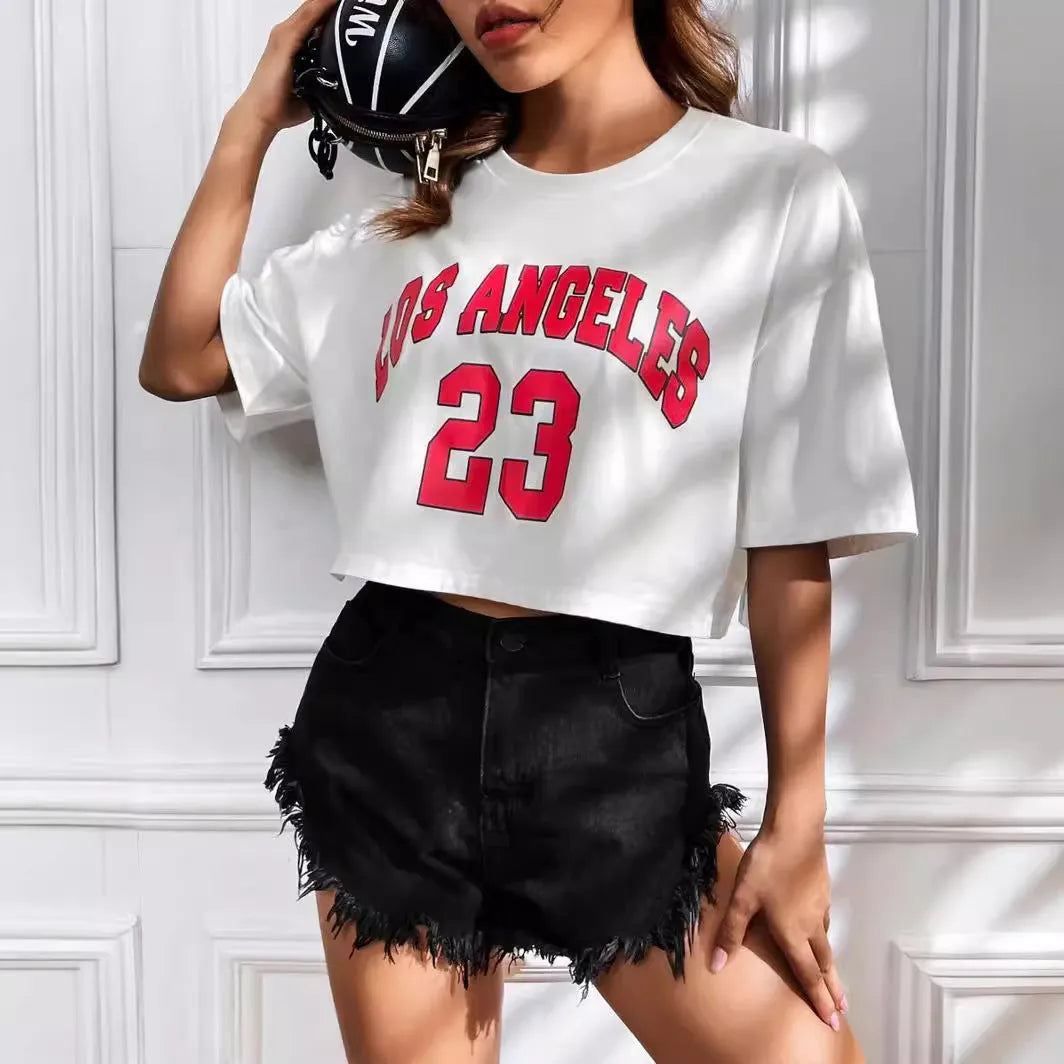 Women's black loose fit cotton T-shirt with exposed navel design and printed white English letters.