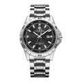 Silver men's quartz watch with luminous hands and stainless steel strap on wrist