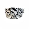 Women's punk style belt with decorative metal rivets on PU leather in animal print pattern with alloy buckle