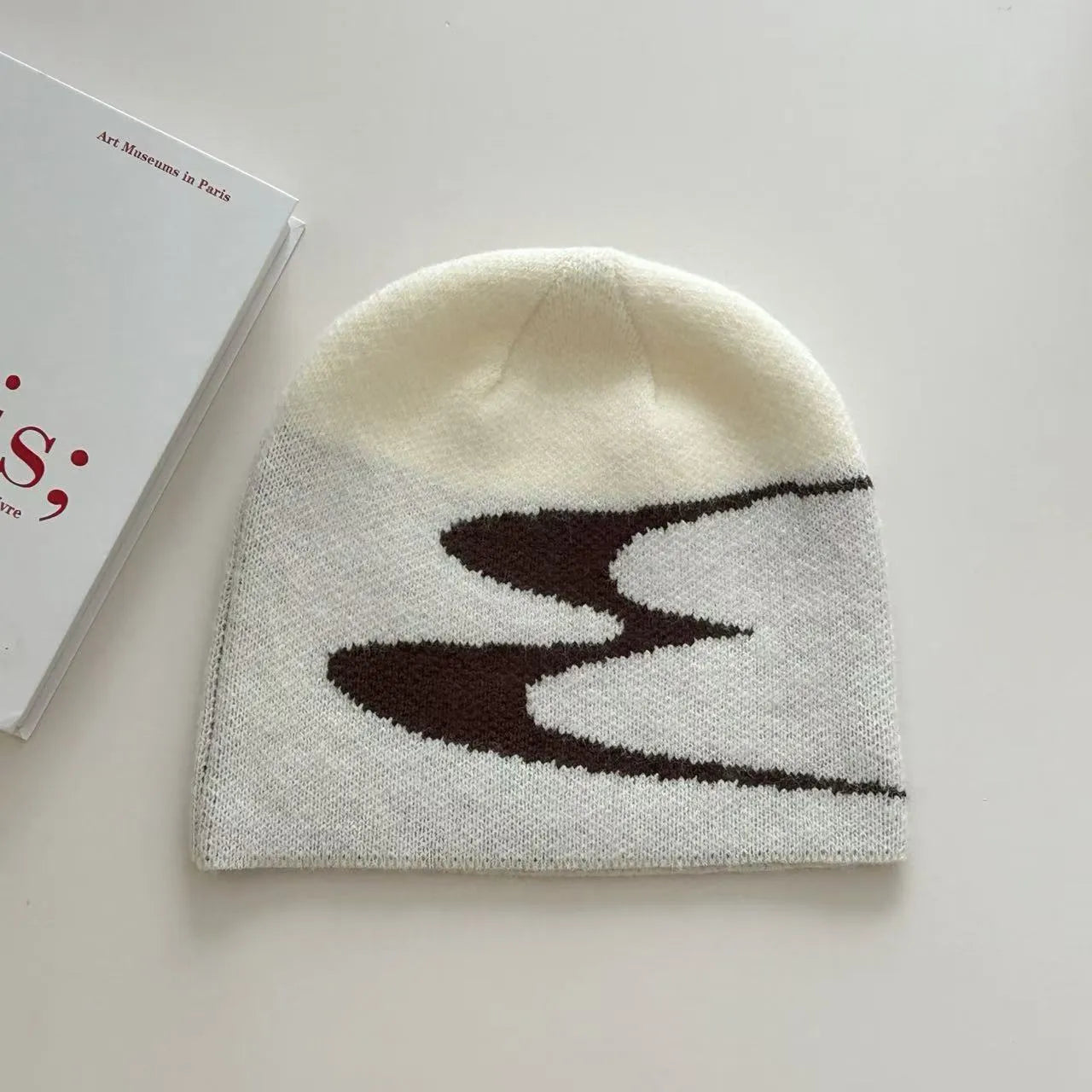 Acrylic thermal beanie hat in black colour on head model