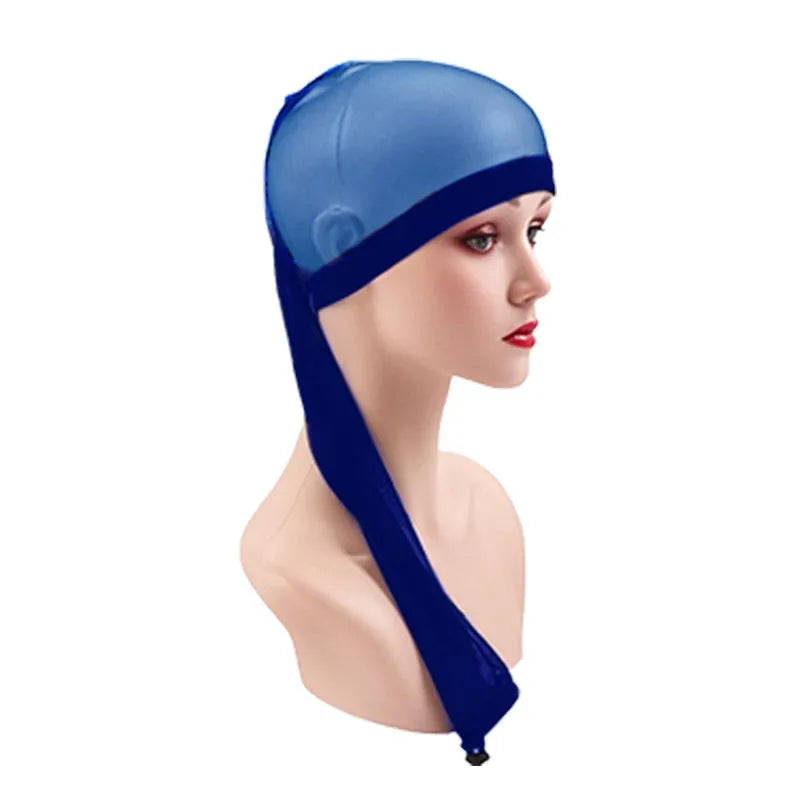 High elasticity mesh wig cap in multiple colours including black, leopard print, and light blue, shown on a model.