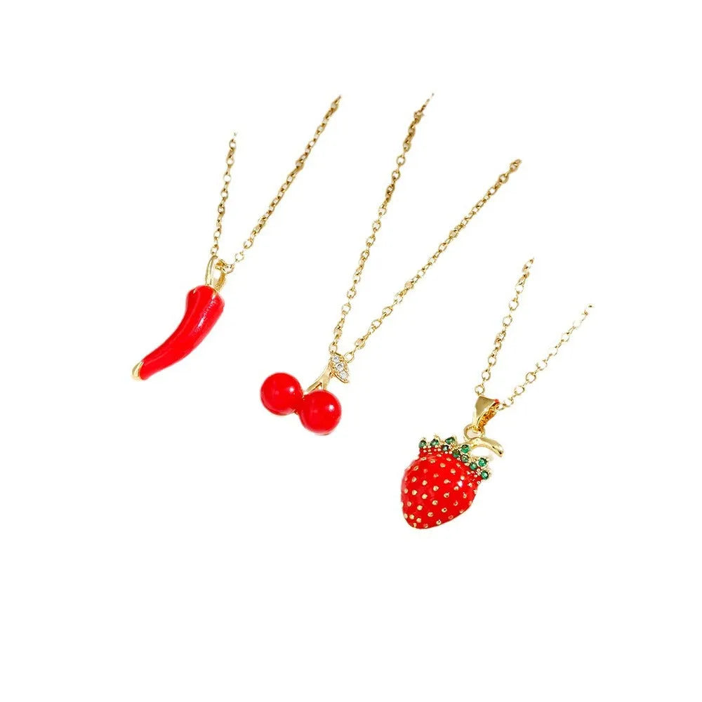 Delicate indie cherry strawberry pepper pendant on a titanium steel O-ring chain necklace.