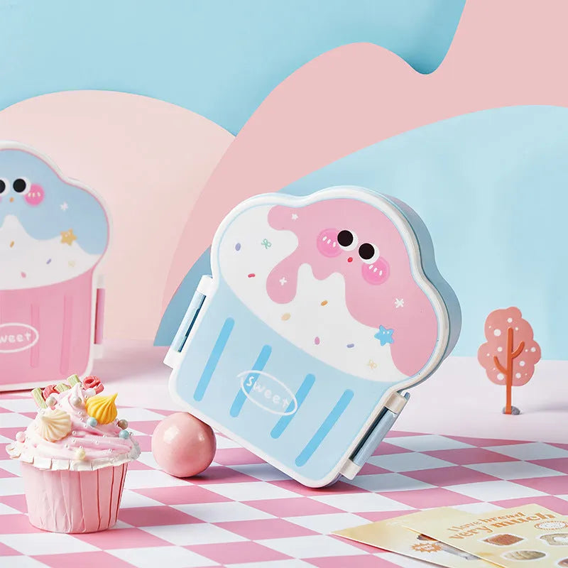 Pink and blue creative ice cream shaped plastic lunch box with compartments, includes spoon and fork.