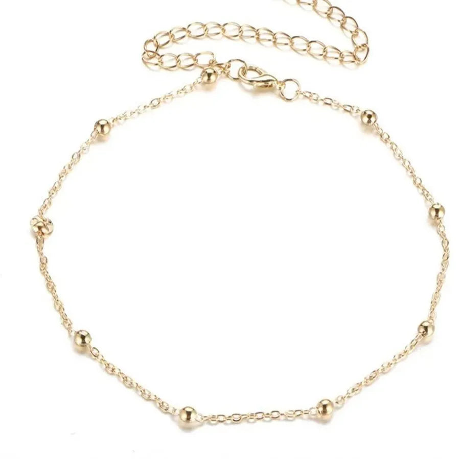 Women's metal anklet with geometric pendant on twisted chain