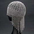 Silver belly dance hat with beaded tassels on black background for performance hair ornament