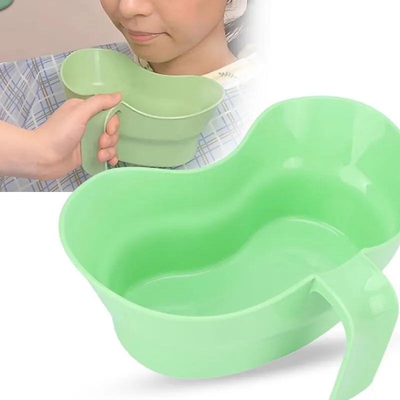 Green plastic gargle cup for bedside patient mouth care and hygiene.