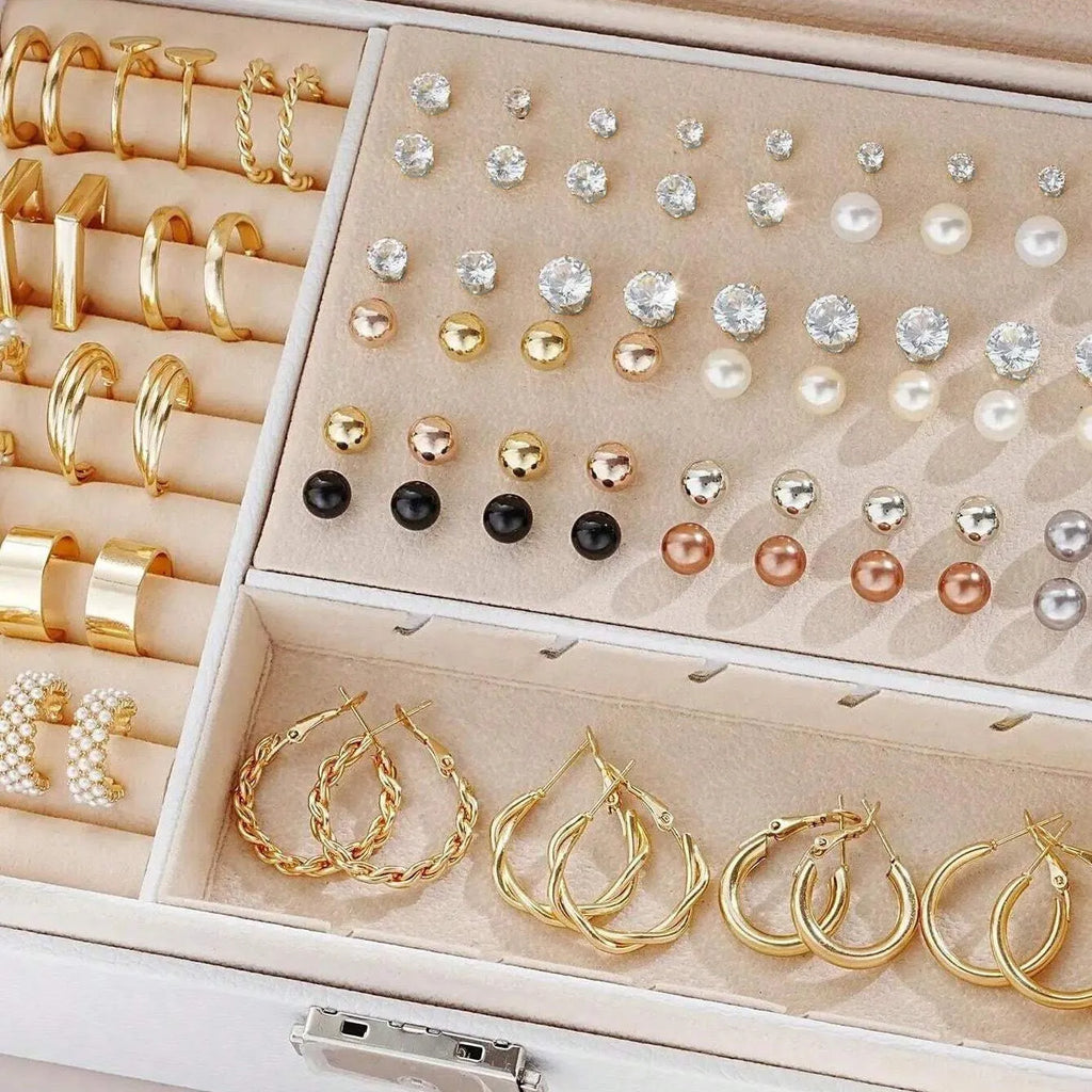 108-piece assortment of gold and yellow alloy stud earrings with geometric shapes and round pearls.