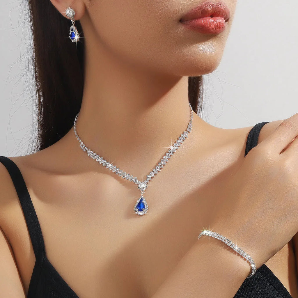 Claw chain necklace and earrings set with drop rhinestones in multiple colour options