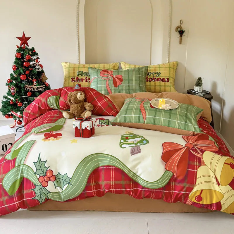 Christmas cartoon character bedding set with duvet cover, fitted sheet and pillowcases laid on a bed