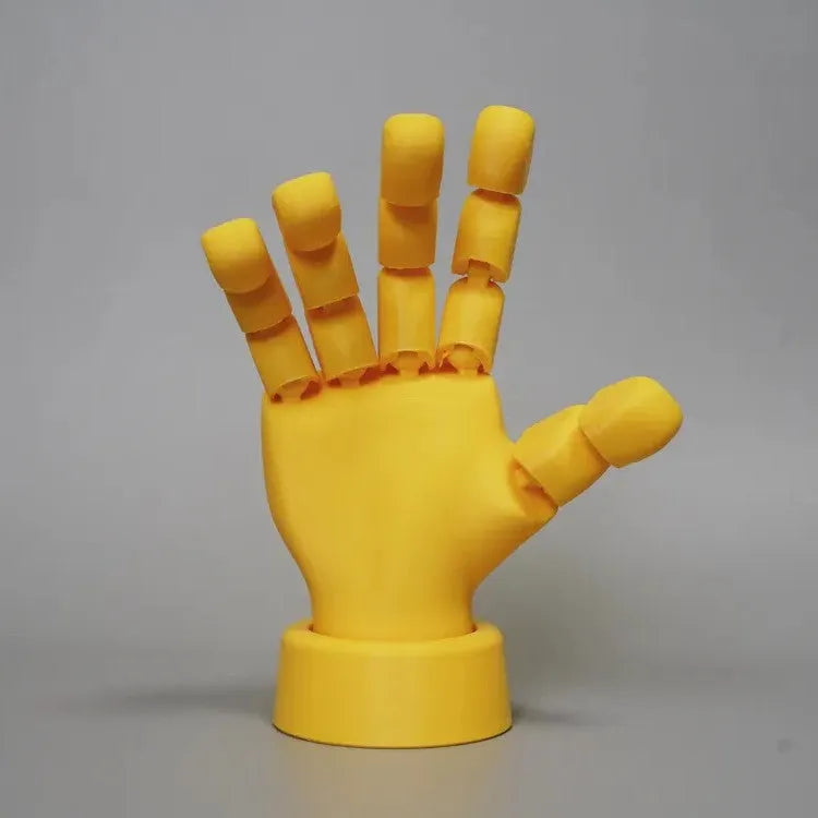 Yellow movable joint hand ornament figurine made from PLA plastic for decorative display.