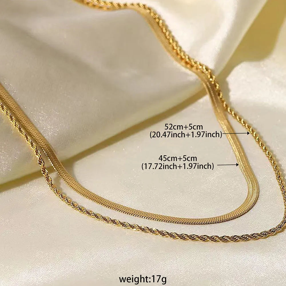Women's silver geometric double-layer twist pendant on an adjustable snake chain necklace.