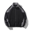 Men's black casual jacket with contrast stitching and side seam pockets, shown on a model.