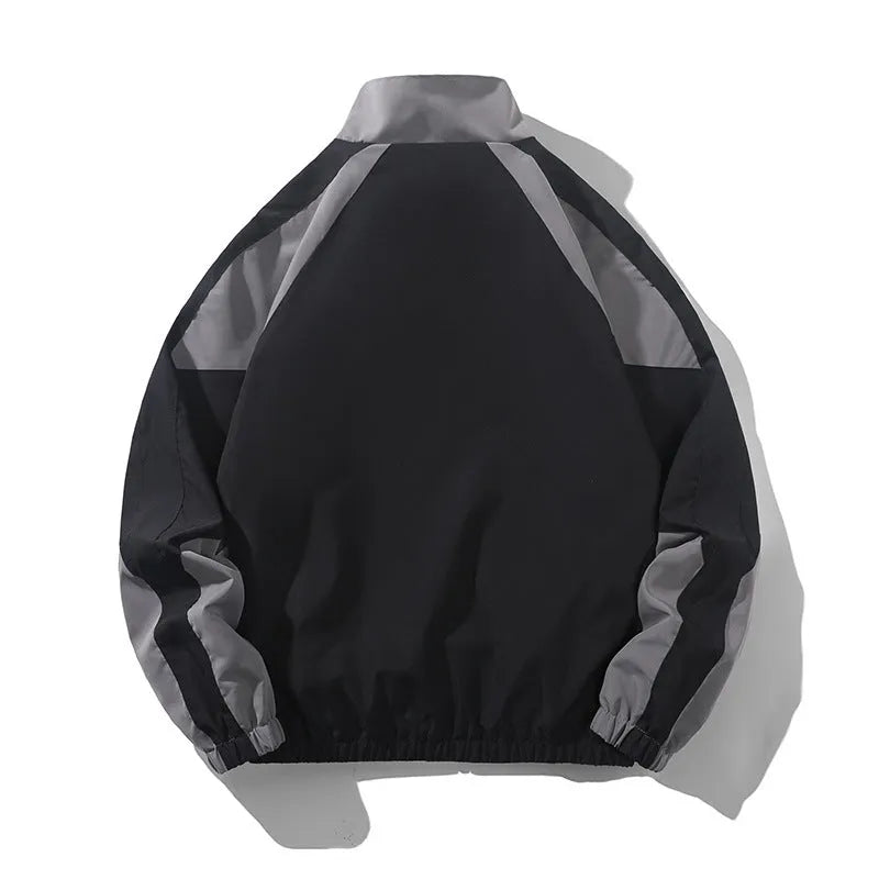 Men's black casual jacket with contrast stitching and side seam pockets, shown on a model.